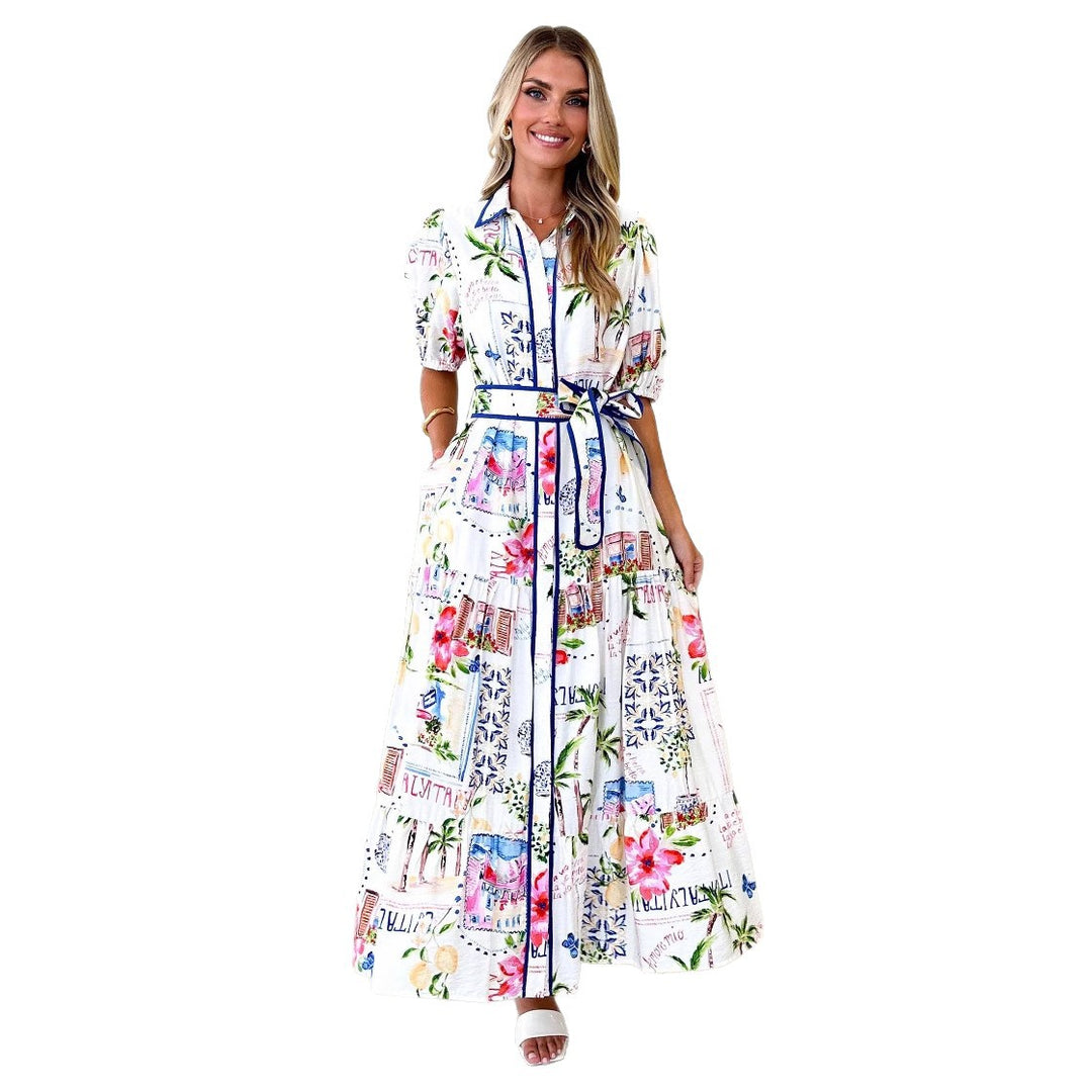 Kvinnens luftige maxikjole med blomsterdesign og praktiske lommer