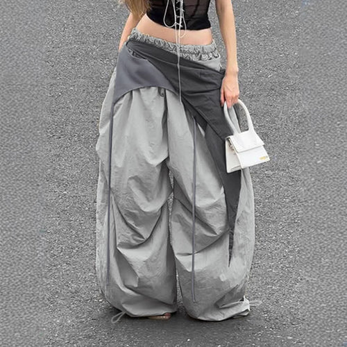 Dame modische High-Waist-bukse med asymmetrisk design og sidelivsnedbinding Skjora