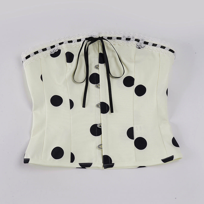 Dameoverdel med stroppeløs design og leken polka-prikk mønster Skjora