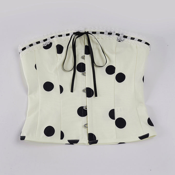 Dameoverdel med stroppeløs design og leken polka-prikk mønster Skjora