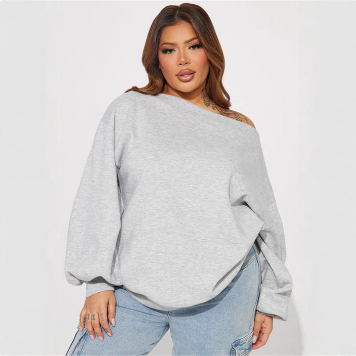 Kvinners oversized sweatshirt med asymmetrisk utringning og ballongformede ermer
