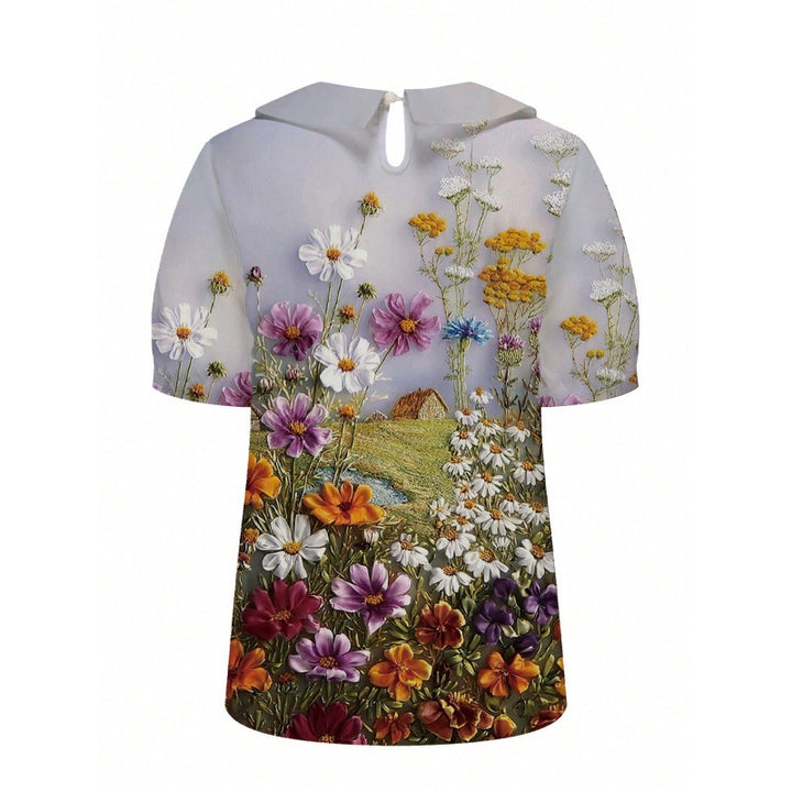 Dame kortermet bluse med florale accenter og klassisk krage Skjora