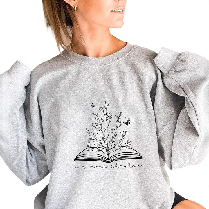 Kvinne genser med elegant blomst design og inspirerende trykk Skjora