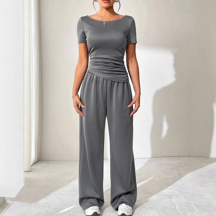 Dame jumpsuit med asymmetrisk snitt og vidbenet design Skjora