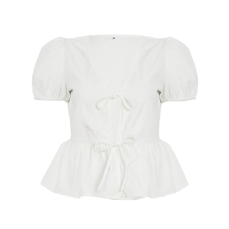 Dame innpakningsbluse med pufferm og feminin peplum-kant Skjora