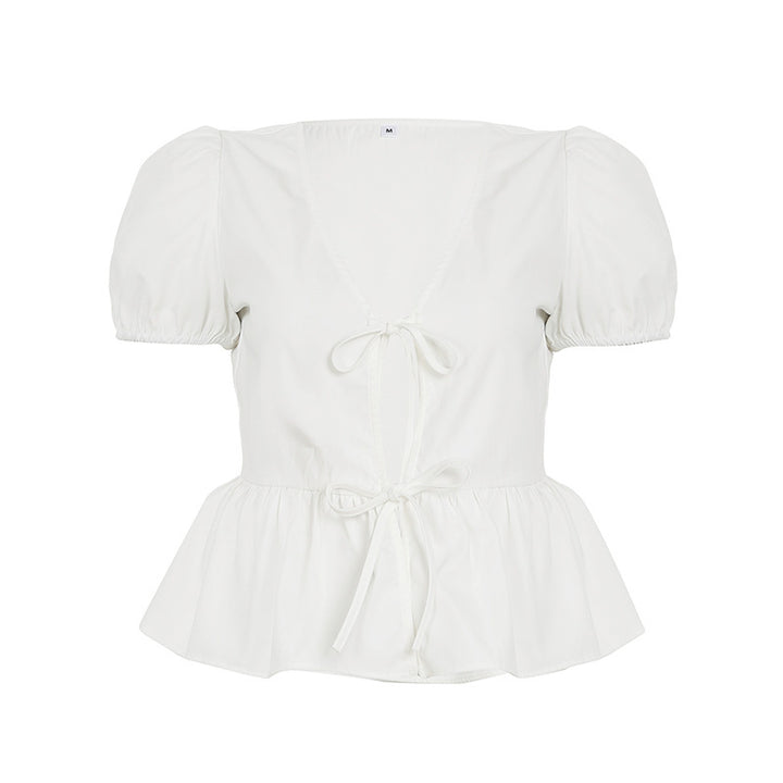 Dame innpakningsbluse med pufferm og feminin peplum-kant Skjora