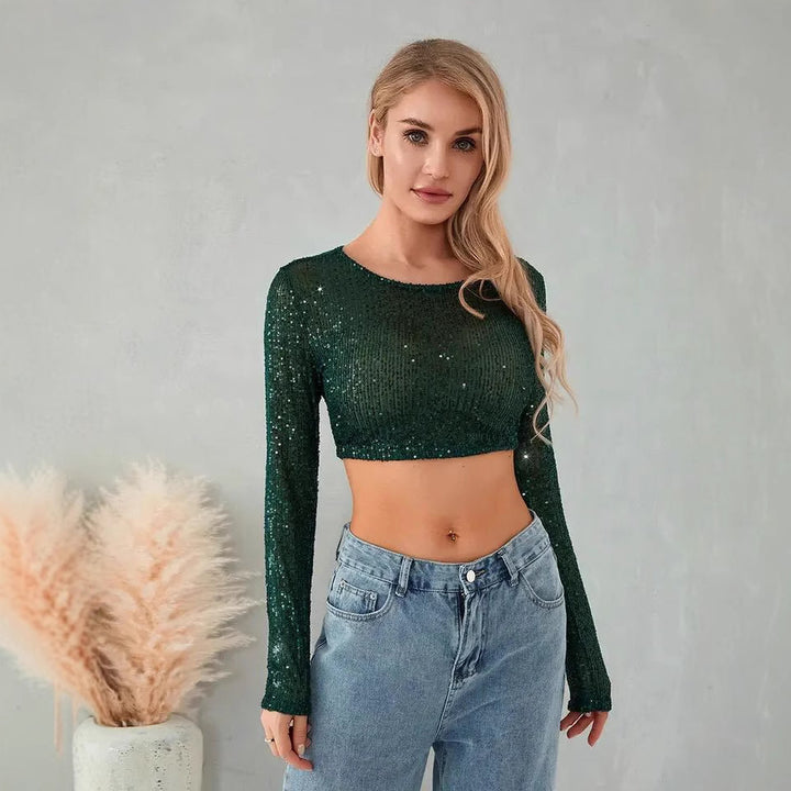Kvinnenes glitrende crop top med lange ermer og figurnær skåret