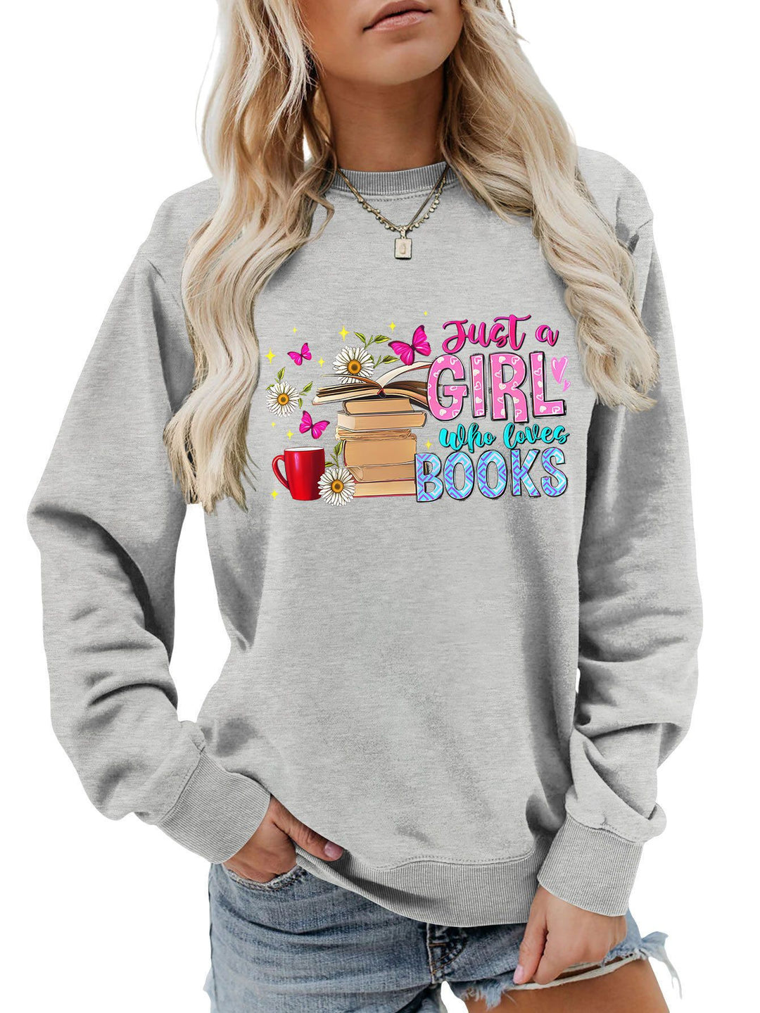 Dame sweatshirt med iøynefallende bokmotiv og ledig passform Skjora