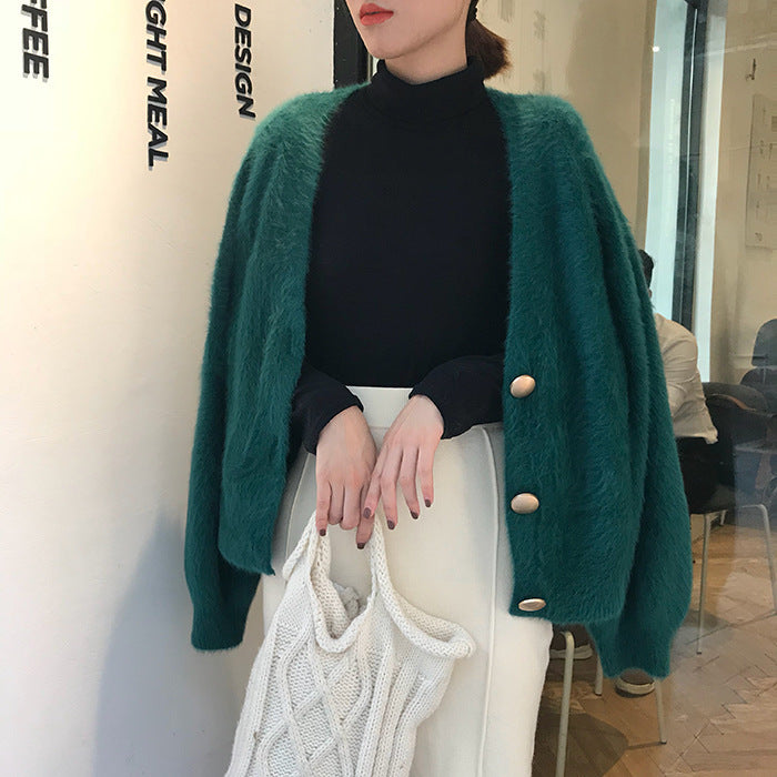 Kvinnens koselige cardigan med store knapper og oversized passform Skjora