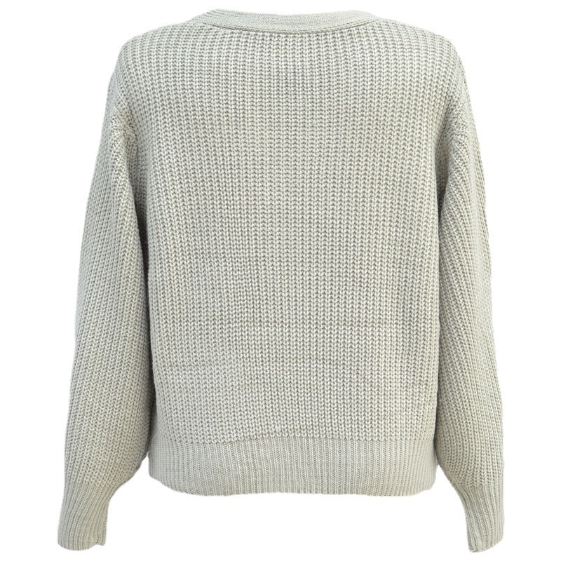 Kvinnens trendy chunky strikkegenser med knappeløsninger og løs passform Skjora