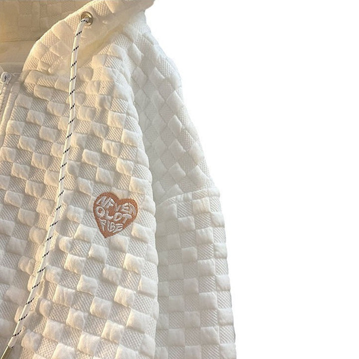 Dame hoodie-jakke laget av strukturelt materiale med praktiske lommer og fashionable design