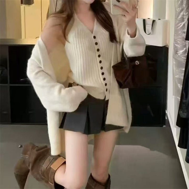 Kvinne chunky strikket cardigan med avtakbare ermer og knapp detaljer Skjora