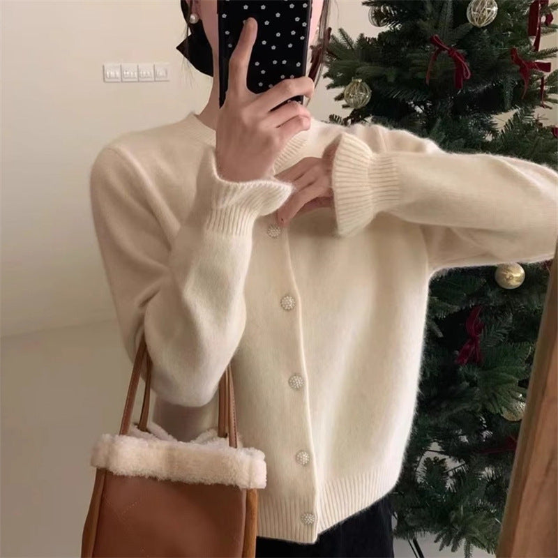 Dame koselig cardigan med elegant perleknappelukking Skjora