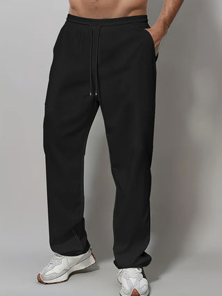 Herre Sporty Avslappet Passform Joggebukser med Elastisk Liv og Sidelommer Skjora