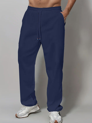 Herre Sporty Avslappet Passform Joggebukser med Elastisk Liv og Sidelommer Skjora