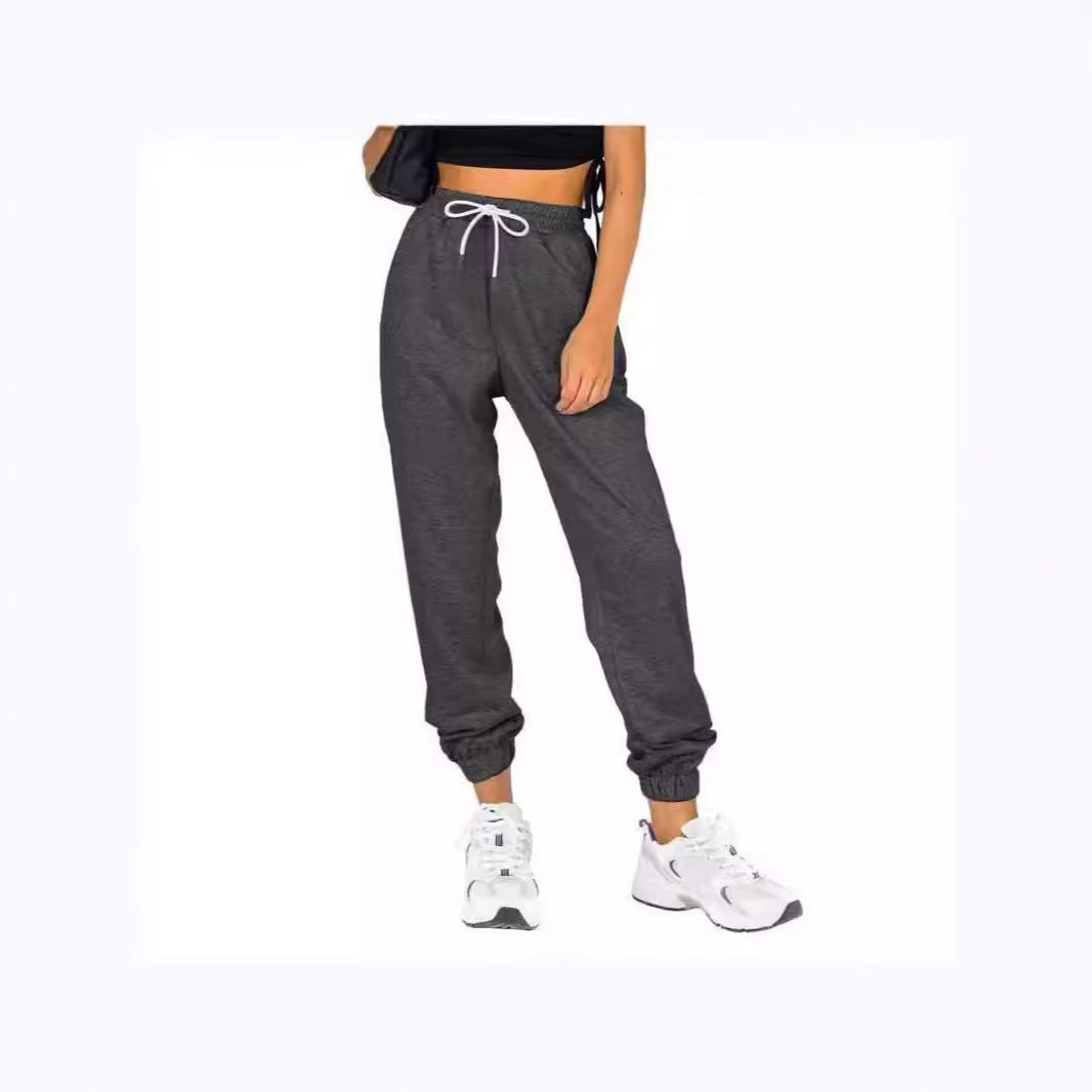 Kvinne sporty joggebukser med praktisk snor og elastisk liv.
