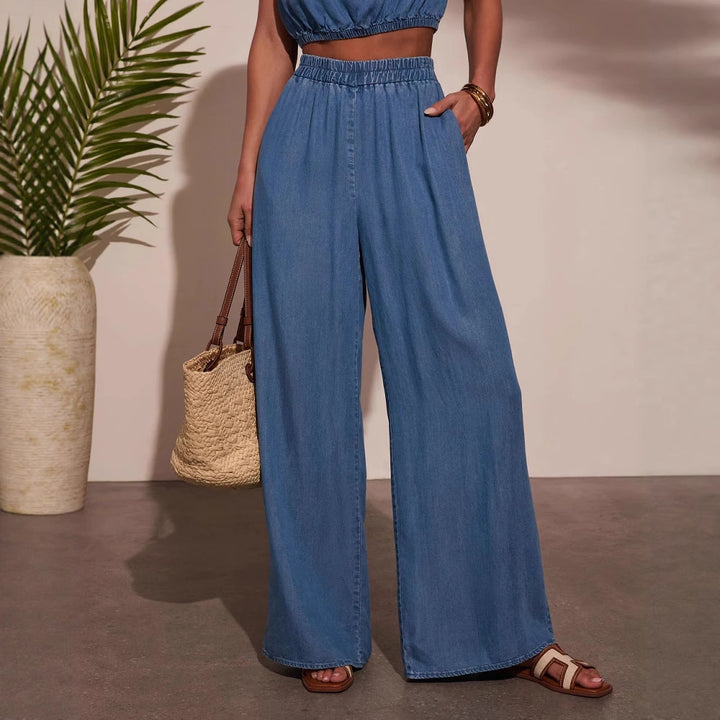 Kvinnens avslappede oversized jeanssett med knyttet topp og vide ben