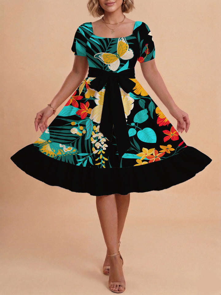 Damen modernes Blumenkleid mit elegantem Taillengürtel und asymmetrischem Saum Skjora