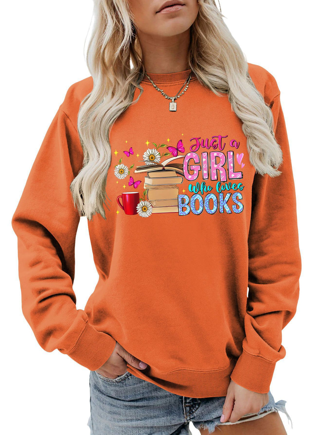 Dame sweatshirt med iøynefallende bokmotiv og ledig passform Skjora