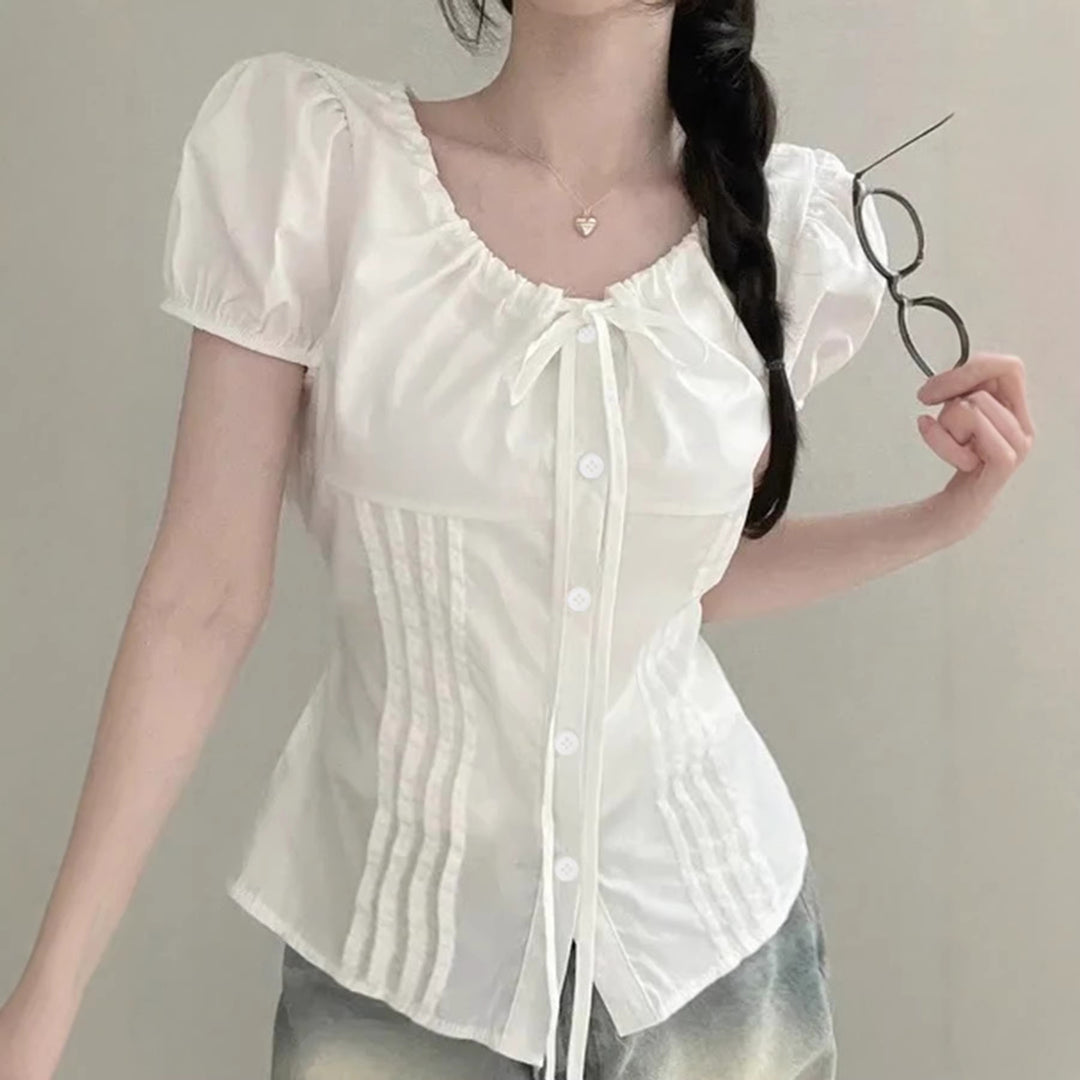 Dame Elegant bluseoverdel med ruffle-detaljer og figurtilpasset silhuett Skjora