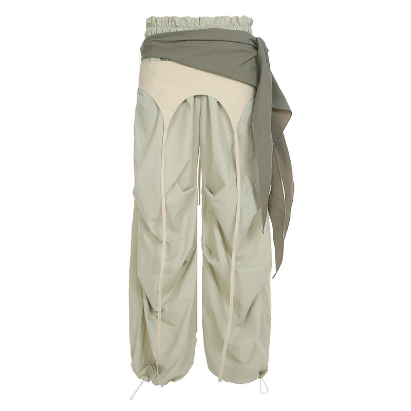 Dame modische High-Waist-bukse med asymmetrisk design og sidelivsnedbinding Skjora