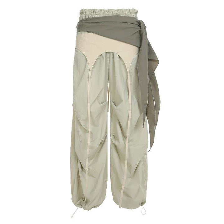 Dame modische High-Waist-bukse med asymmetrisk design og sidelivsnedbinding Skjora
