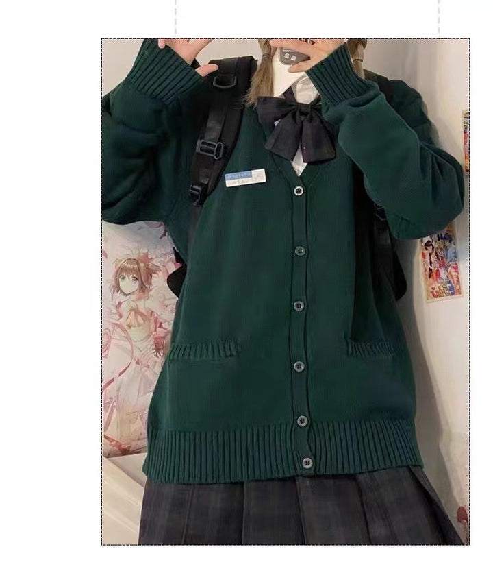Kvinnes college cardigan med klassisk krage og dekorativ sløjfedesign Skjora