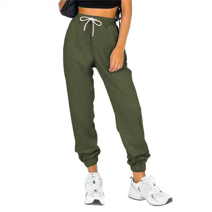 Kvinne sporty joggebukser med praktisk snor og elastisk liv.