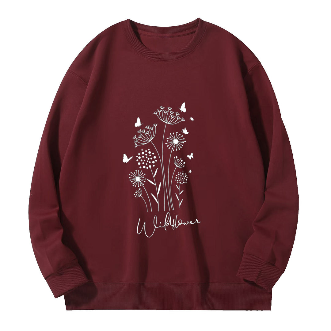 Kvinnelig sweatshirt med blomstertrykk av villblomster og koselig innerfor Skjora
