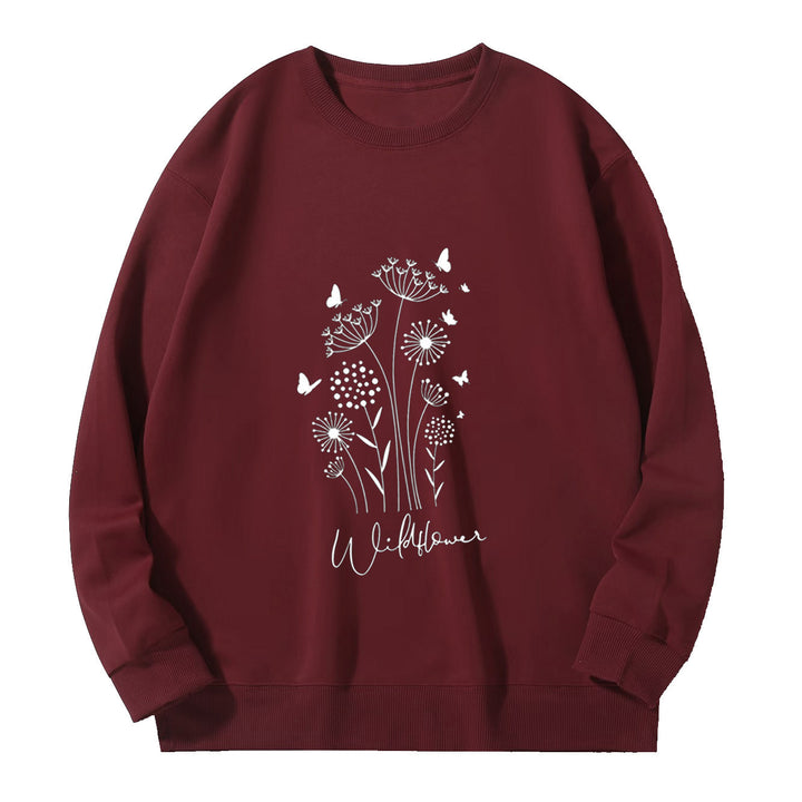 Kvinnelig sweatshirt med blomstertrykk av villblomster og koselig innerfor Skjora