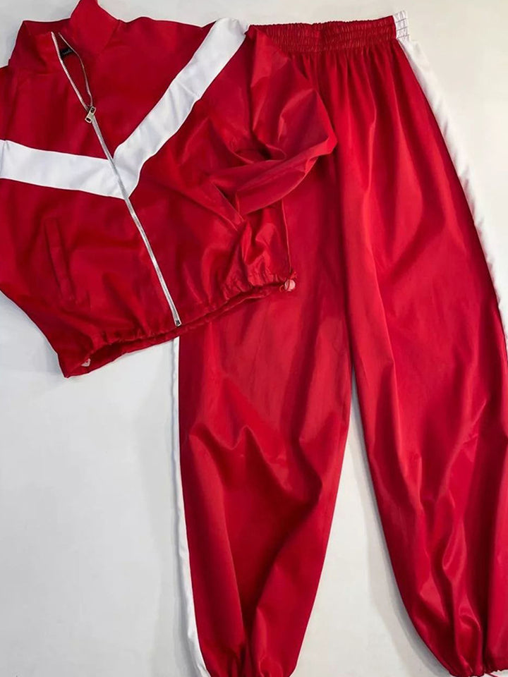Kvinnelig sporty vindjakke med elastiske mansjetter og reflekterende detaljer Skjora