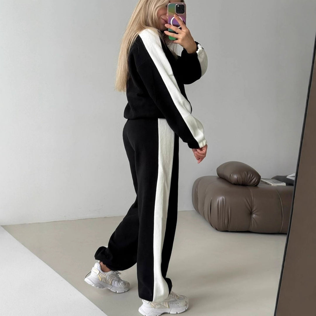Kvinnes sporty fleece treningsoverall med høy krage og sidestriper Skjora