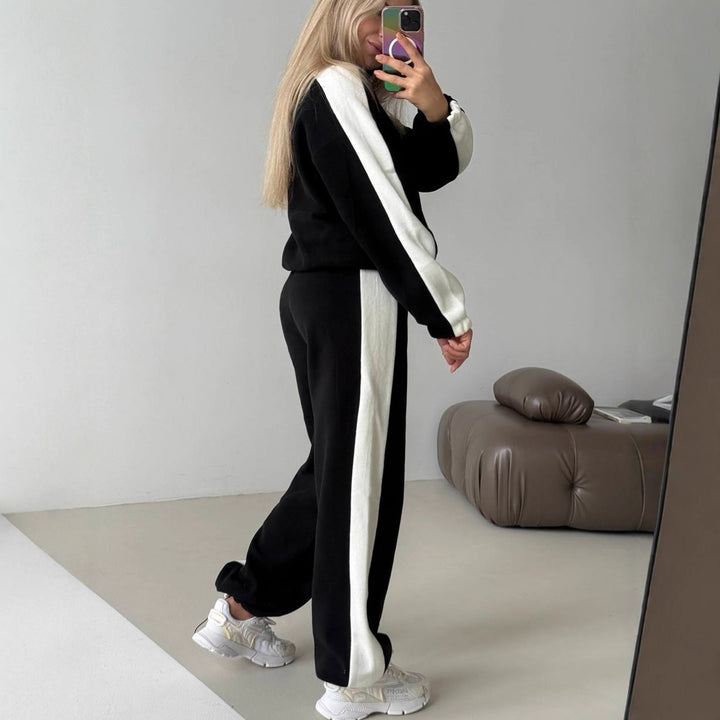 Kvinnes sporty fleece treningsoverall med høy krage og sidestriper Skjora