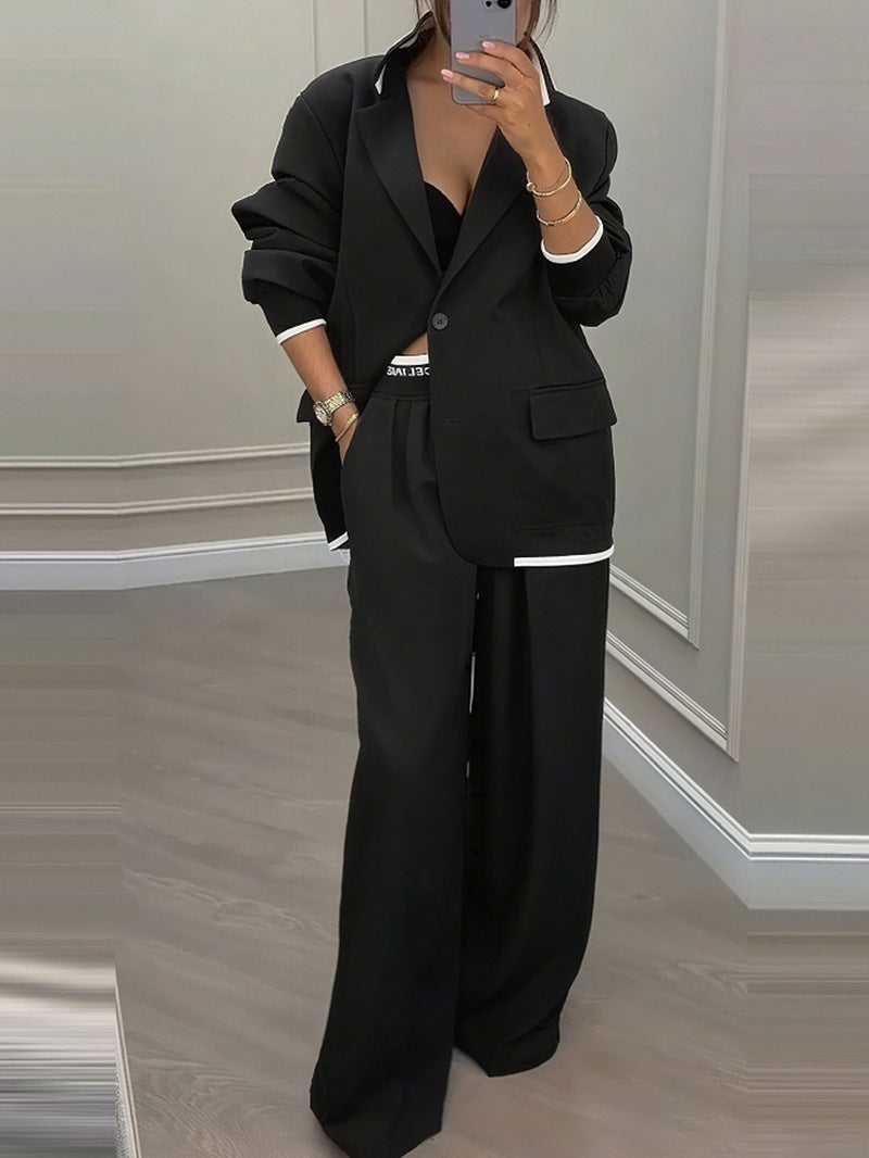 Kvinnelig elegant blazer og bukse sett med bred kutt og moderne design Skjora