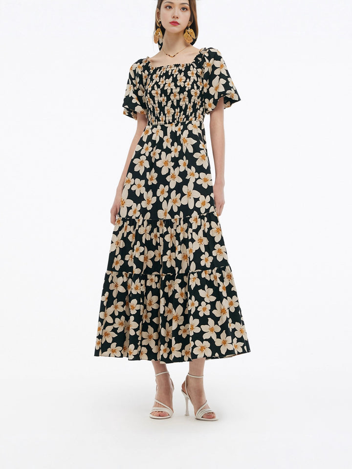Dame Maxikjole med voluminøs skjørt og blomsterdesign Skjora