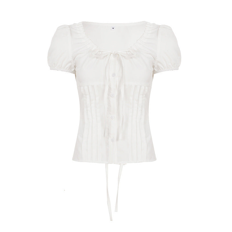 Dame Elegant bluseoverdel med ruffle-detaljer og figurtilpasset silhuett Skjora