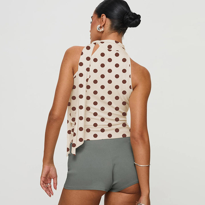 Dame asymmetrisk polka-prikket topp med høye skjæringslinjer og elegant halterdesign Skjora