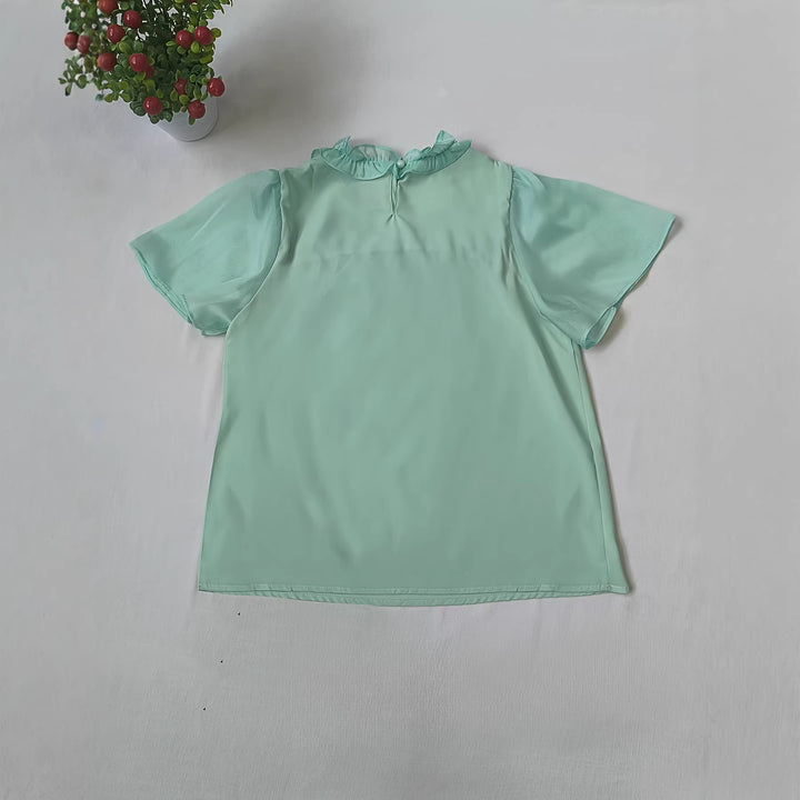 Damer Elegant bluse med volangdetaljer og gjennomsiktige ermer Skjora