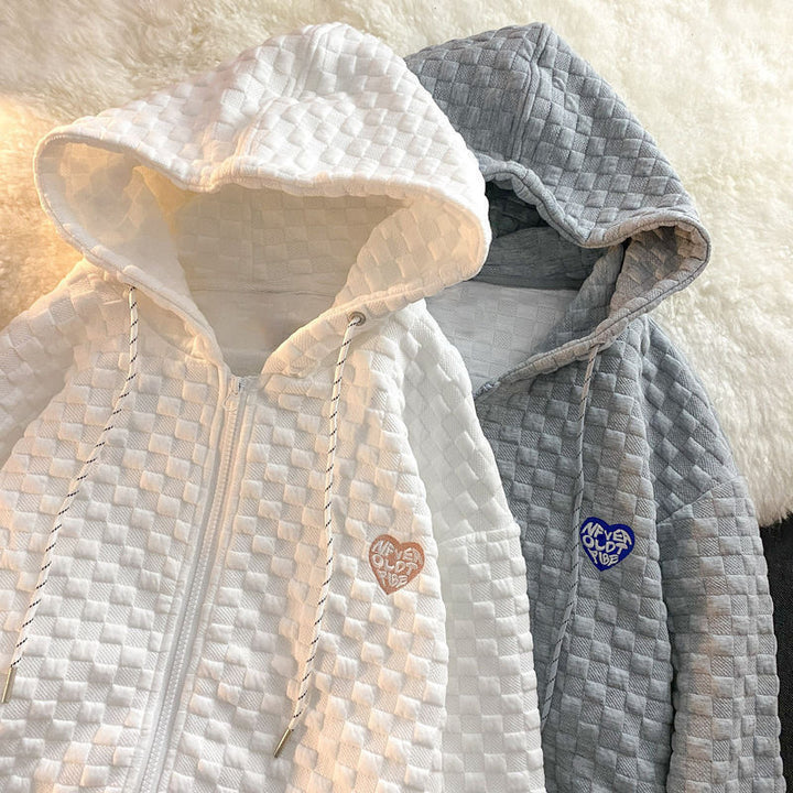 Dame hoodie-jakke laget av strukturelt materiale med praktiske lommer og fashionable design
