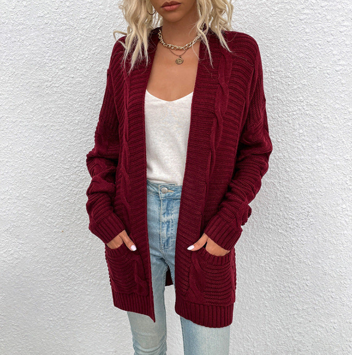 Kvinne chunky strikk cardigan med lommer og åpen frontdesign Skjora