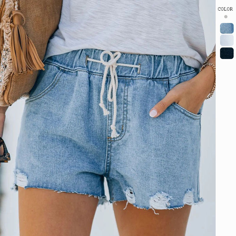 Kvinners vintage denim shorts med elastisk midjebånd og trendy ødelagte detaljer
