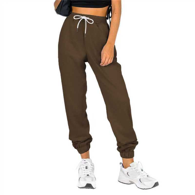 Kvinne sporty joggebukser med praktisk snor og elastisk liv.