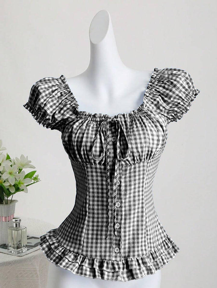 Dame ruffled topp i rutete design med knappdetaljer og elastisk fald Skjora