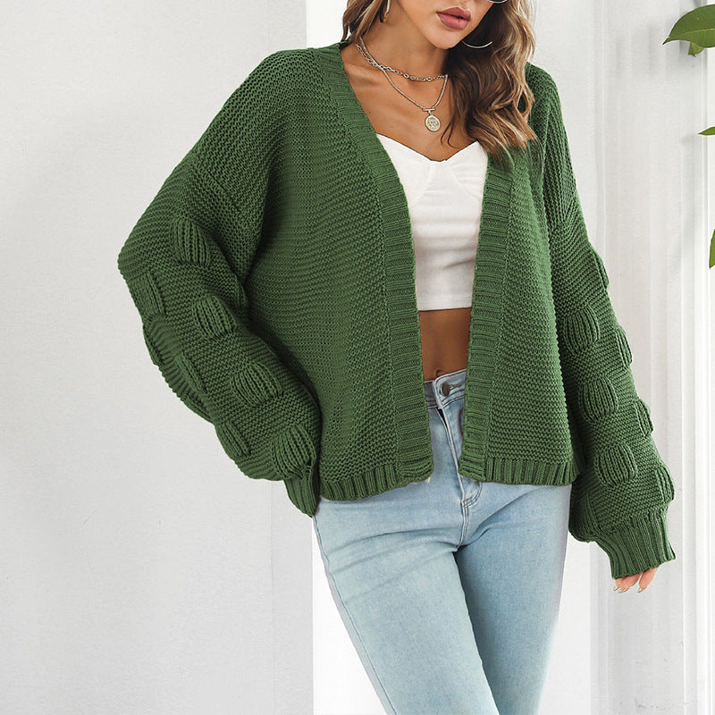 Kvinne chunky strikket cardigan med voluminøse ermer og åpen front Skjora