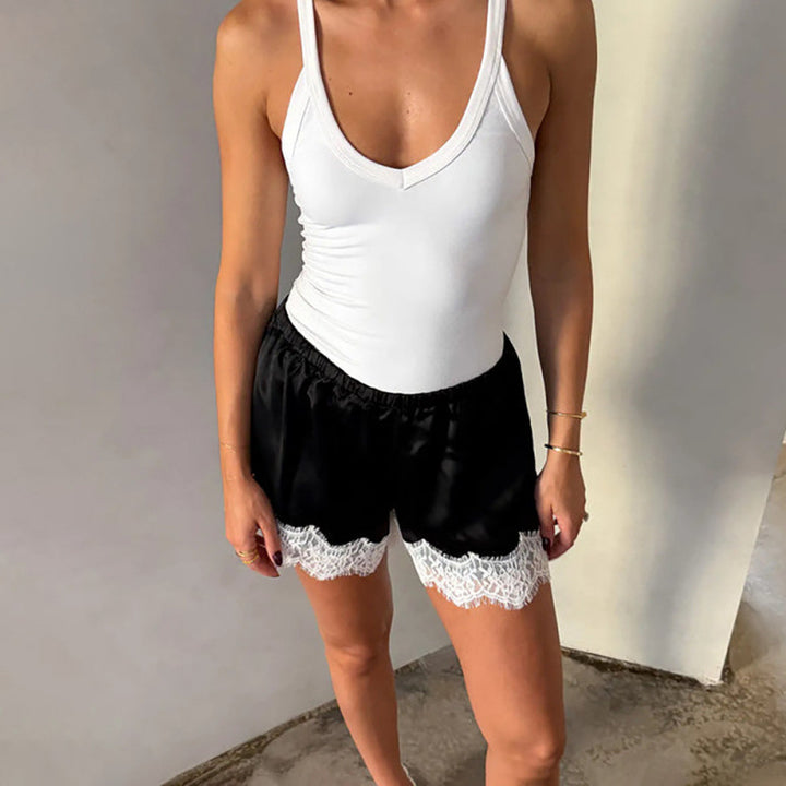 Dame Sportbodysuit med elastiske shorts og blonderdetalj Skjora