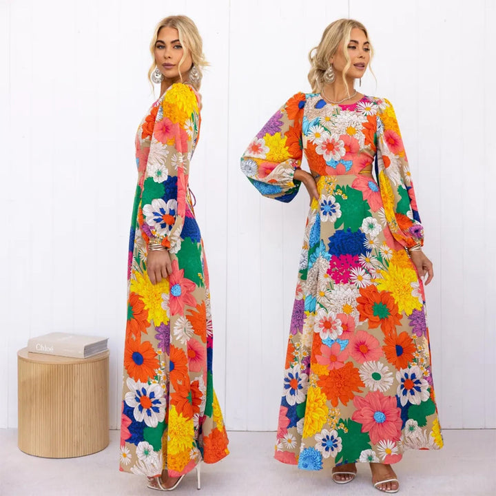 Kvinne blomster maxi kjole med voluminøse ermer og helårs blomstertrykk Skjora