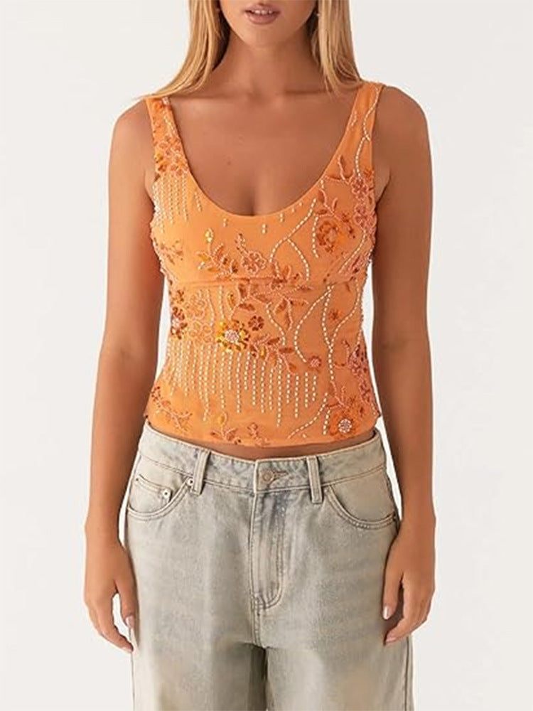 Damescouture topp med blomstret rhinestonesdesign og tettsittende snitt