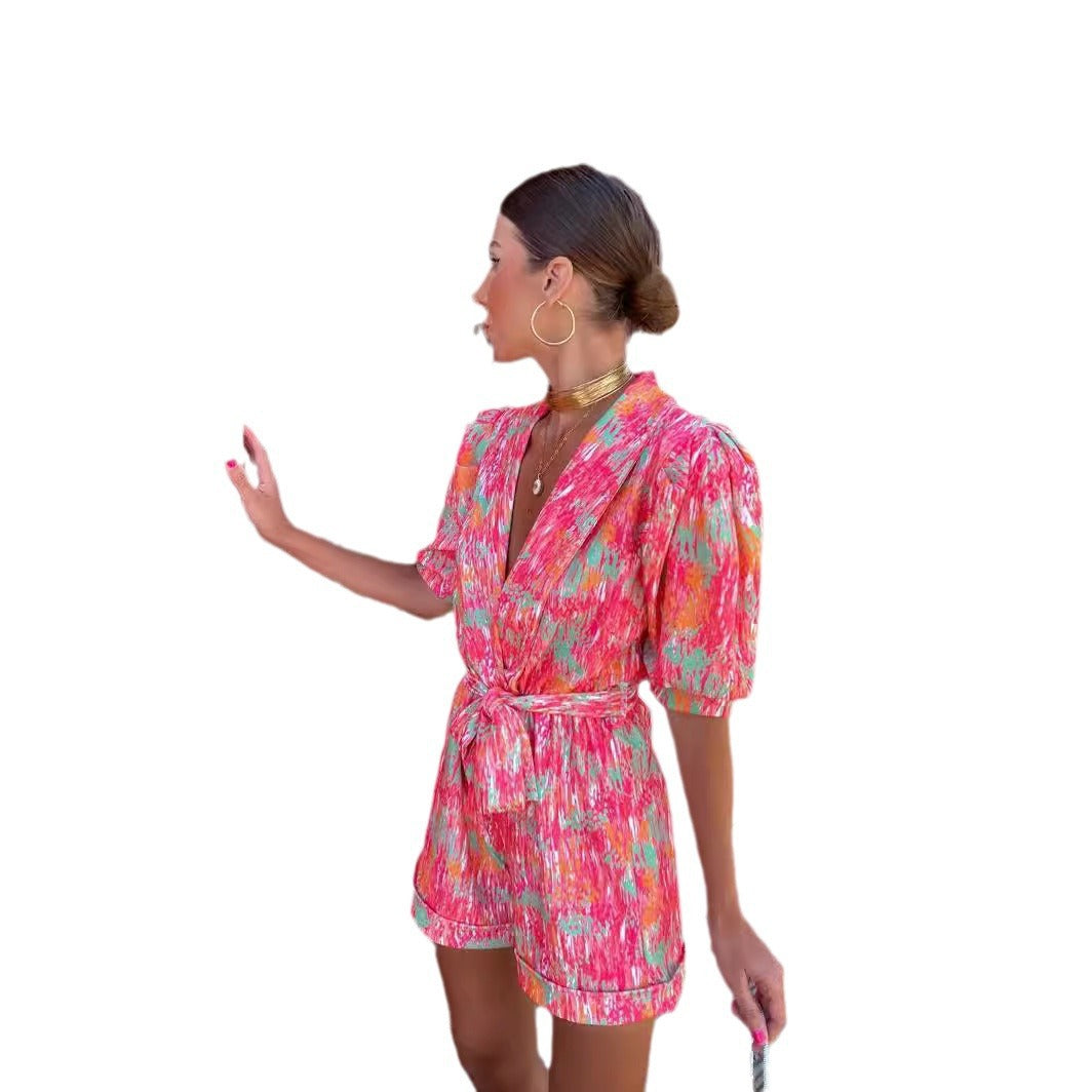 Kvinnelig Elegant Jumpsuit med Dyp V-Hals og Knappbar Belte Skjora
