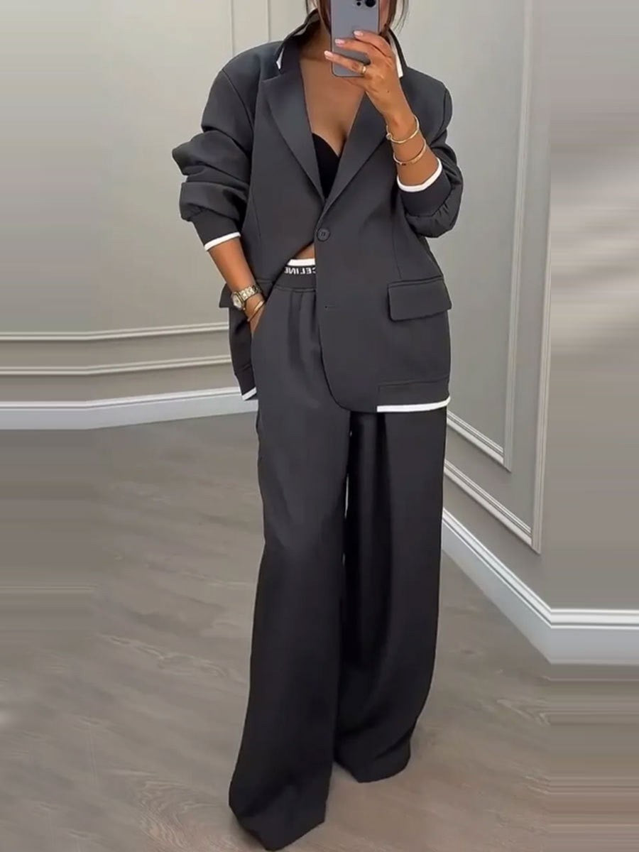 Kvinnes moderne oversized blazer sett med elegante dressbukser Skjora