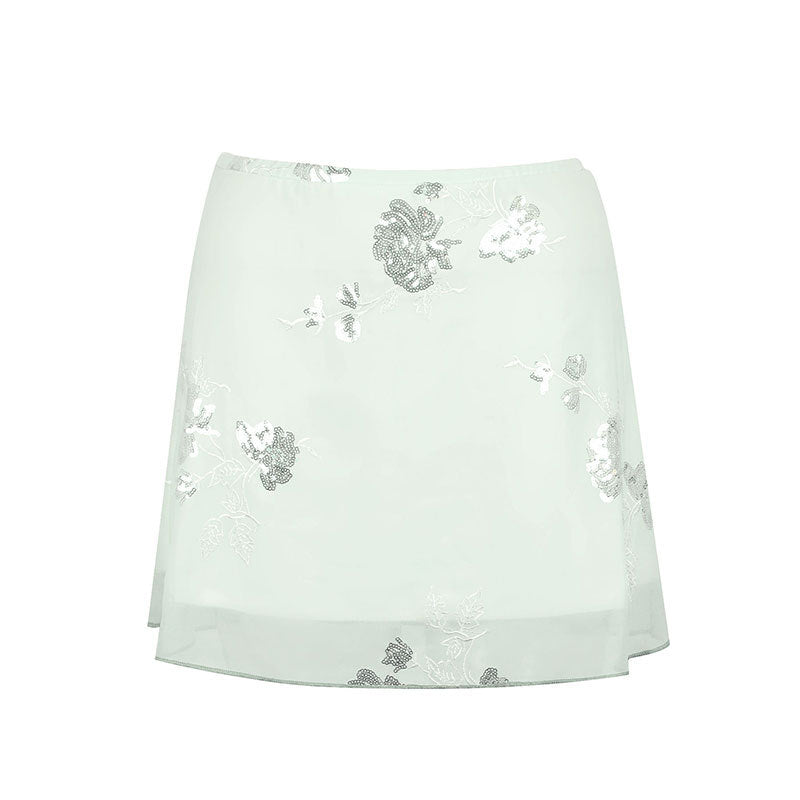 Dame gjennomsiktig skjørt med floralt design og glitrende detaljer Skjora